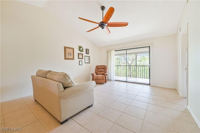 17458 Blueberry Hill Dr Unit F, Fort Myers, FL 33908 - living area featuring vaulted ceiling, ceiling fan, light tile patterned flooring, baseboards, and a textured ceiling