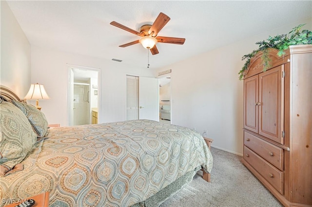 17458 Blueberry Hill Dr Unit F, Fort Myers, FL 33908 - bedroom featuring light colored carpet, a closet, ensuite bathroom, and ceiling fan