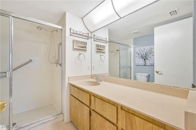 17458 Blueberry Hill Dr Unit F, Fort Myers, FL 33908 - bathroom with toilet, a stall shower, vanity, and tile patterned flooring