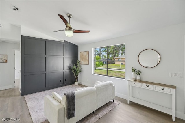 4906 5th St W, Lehigh Acres, FL 33971 - living room featuring ceiling fan, wood finished floors, baseboards, and lofted ceiling