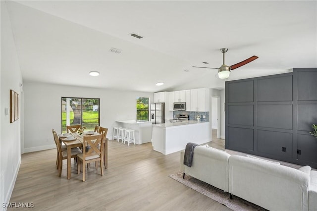 4906 5th St W, Lehigh Acres, FL 33971 - living room featuring lofted ceiling, ceiling fan, light wood-style flooring, baseboards, and recessed lighting