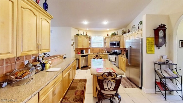 1108 Lee Ave, Lehigh Acres, FL 33972 - kitchen featuring stainless steel appliances, light brown cabinets, tasteful backsplash, and recessed lighting