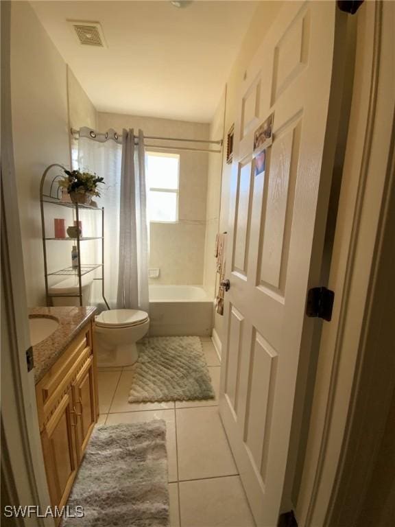 1108 Lee Ave, Lehigh Acres, FL 33972 - full bath featuring toilet, tile patterned floors, vanity, and shower / bath combo with shower curtain