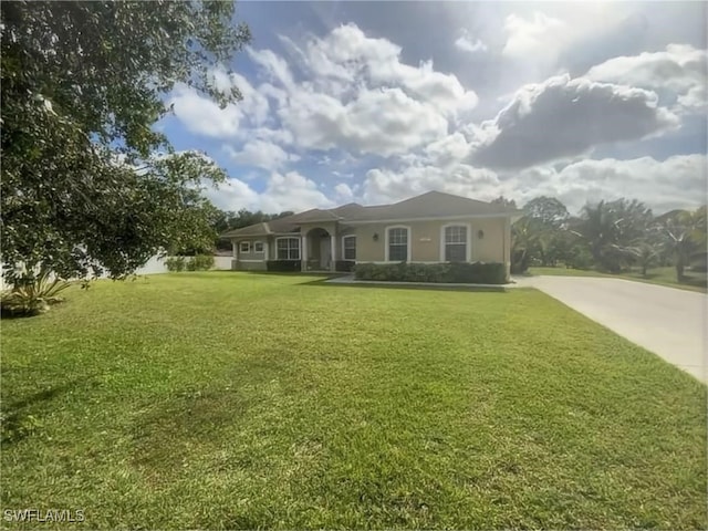 1108 Lee Ave, Lehigh Acres, FL 33972 - single story home with a front yard and stucco siding