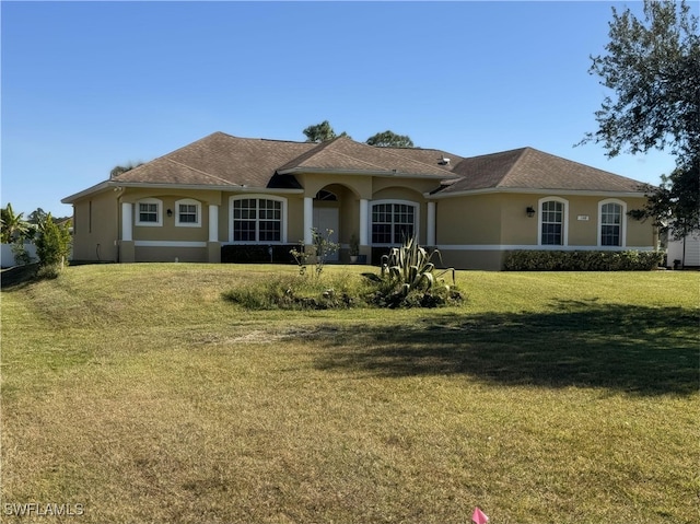 1108 Lee Ave, Lehigh Acres, FL 33972 - ranch-style home featuring stucco siding and a front yard