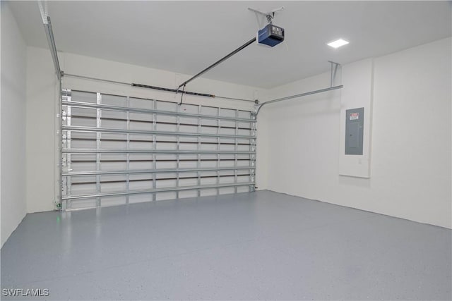 1254 Nimitz Blvd, Lehigh Acres, FL 33974 - garage with electric panel and a garage door opener