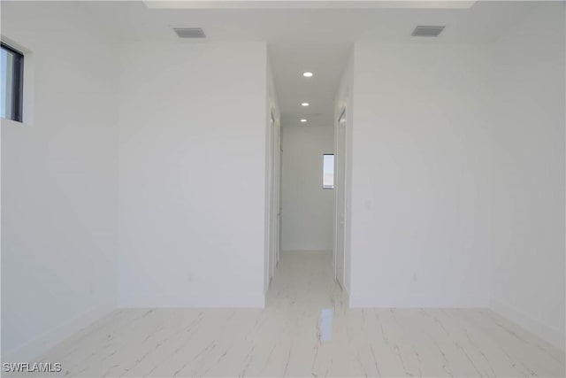 1254 Nimitz Blvd, Lehigh Acres, FL 33974 - empty room with recessed lighting and marble look tile flooring