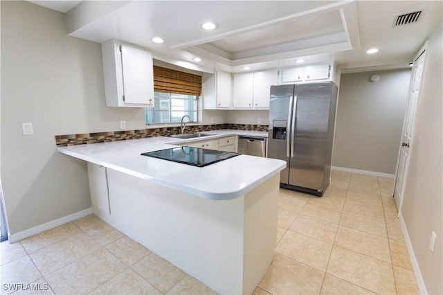 1644 N Hermitage Rd, Fort Myers, FL 33919 - kitchen featuring stainless steel appliances, a sink, a peninsula, a tray ceiling, and baseboards