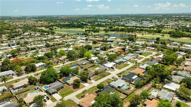 1644 N Hermitage Rd, Fort Myers, FL 33919 - aerial view of property and surrounding area featuring a large body of water and nearby suburban area