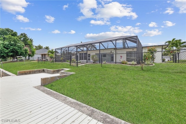 4969 Vincennes St, Cape Coral, FL 33904 - rear view of house with glass enclosure and a deck
