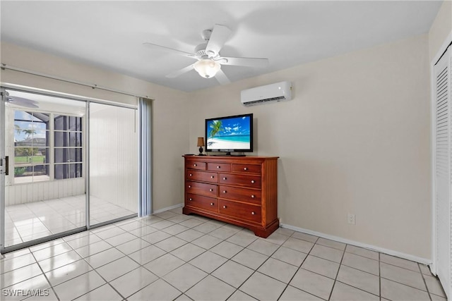 4969 Vincennes St, Cape Coral, FL 33904 - bedroom featuring a wall mounted AC, a closet, baseboards, and light tile patterned flooring