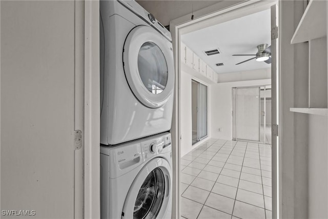4969 Vincennes St, Cape Coral, FL 33904 - laundry area with stacked washer / dryer, a ceiling fan, and light tile patterned floors