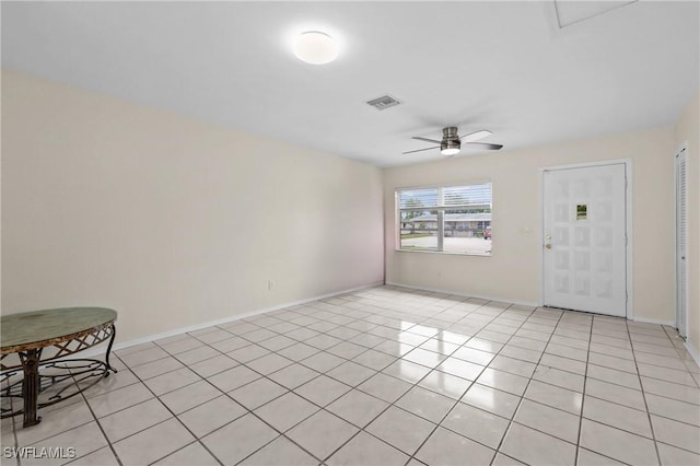 4969 Vincennes St, Cape Coral, FL 33904 - empty room with ceiling fan, light tile patterned floors, and baseboards