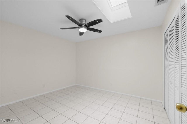 4969 Vincennes St, Cape Coral, FL 33904 - unfurnished bedroom featuring a skylight, a closet, baseboards, and ceiling fan