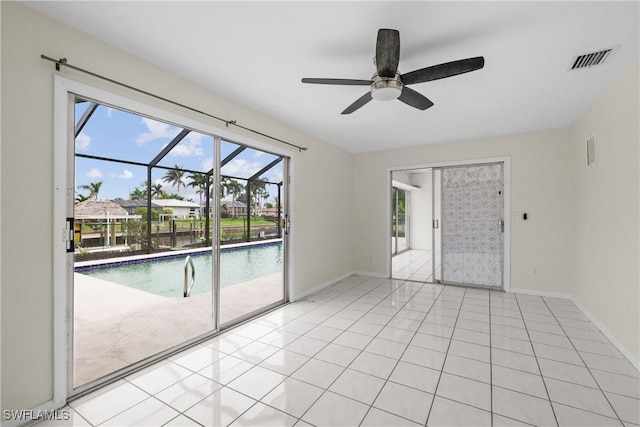 4969 Vincennes St, Cape Coral, FL 33904 - spare room featuring a ceiling fan, healthy amount of natural light, and baseboards