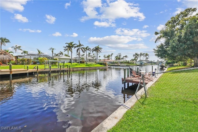 4969 Vincennes St, Cape Coral, FL 33904 - dock with a water view, a lawn, and a residential view