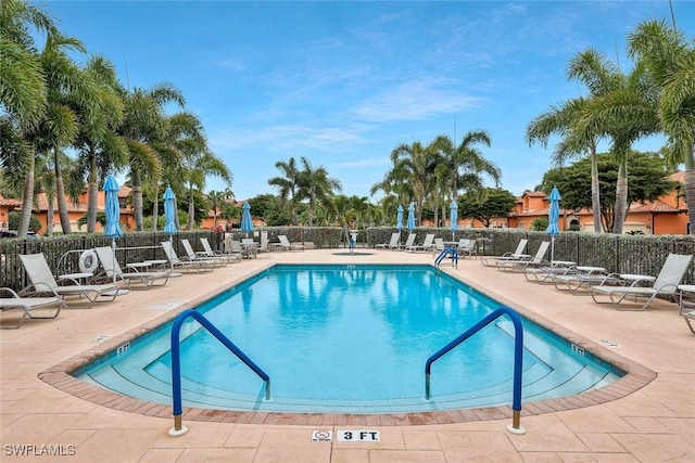 5795 Grande Reserve Way Unit 1001, Naples, FL 34110 - community pool with a patio area