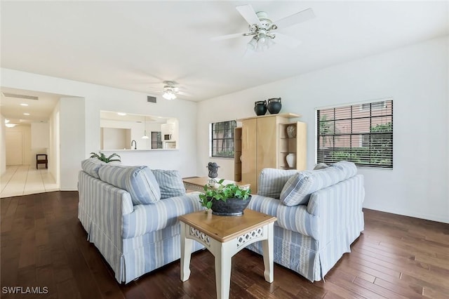 5795 Grande Reserve Way Unit 1001, Naples, FL 34110 - living area featuring ceiling fan and dark wood-style flooring