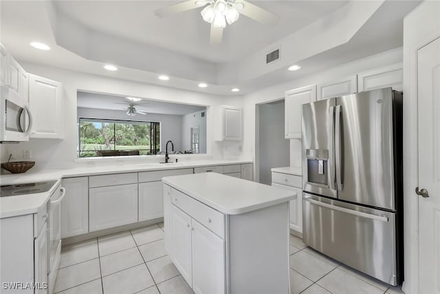 5795 Grande Reserve Way Unit 1001, Naples, FL 34110 - kitchen featuring appliances with stainless steel finishes, ceiling fan, light tile patterned floors, and recessed lighting