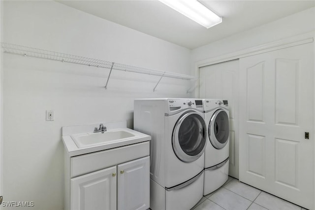 5795 Grande Reserve Way Unit 1001, Naples, FL 34110 - washroom with independent washer and dryer, cabinet space, and light tile patterned flooring