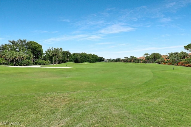 5795 Grande Reserve Way Unit 1001, Naples, FL 34110 - view of home's community featuring golf course view, a yard, and view of scattered trees