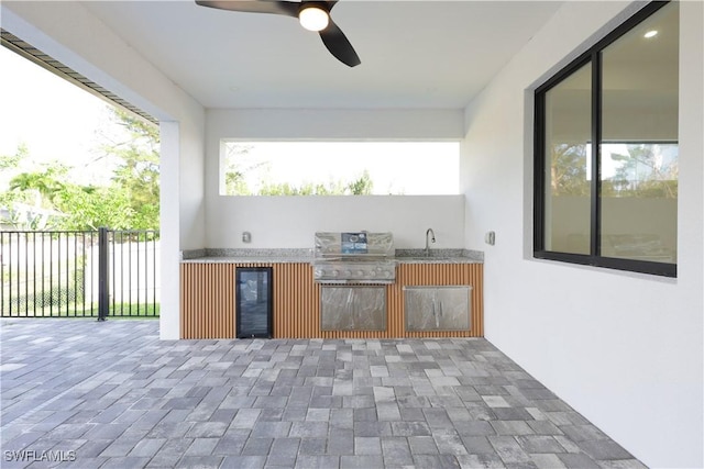 2219 Surfside Blvd, Cape Coral, FL 33991 - view of patio / terrace featuring wine cooler, a ceiling fan, and a sink