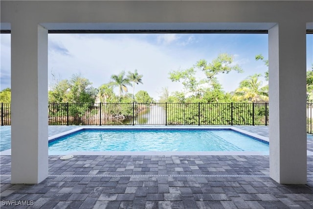 2219 Surfside Blvd, Cape Coral, FL 33991 - view of swimming pool featuring a patio area and a fenced backyard