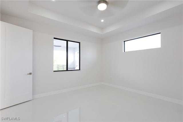 2219 Surfside Blvd, Cape Coral, FL 33991 - unfurnished room featuring a raised ceiling, recessed lighting, ceiling fan, and concrete flooring