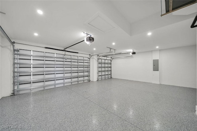 2219 Surfside Blvd, Cape Coral, FL 33991 - garage with a garage door opener, recessed lighting, and electric panel