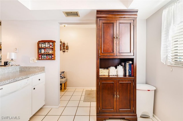6324 Sugar Bush Ln Unit F, Fort Myers, FL 33908 - bar area with dishwasher, light tile patterned flooring, and baseboards