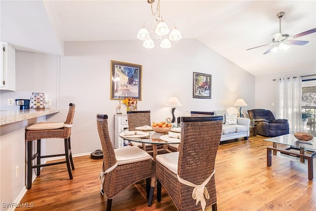 6324 Sugar Bush Ln Unit F, Fort Myers, FL 33908 - dining space featuring lofted ceiling, light wood-style floors, a ceiling fan, and baseboards