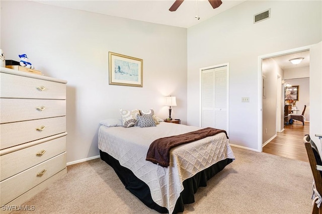 6324 Sugar Bush Ln Unit F, Fort Myers, FL 33908 - bedroom featuring carpet flooring, a closet, baseboards, a ceiling fan, and high vaulted ceiling