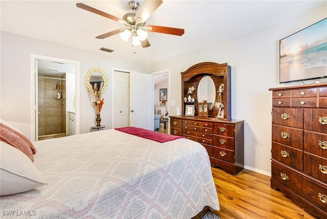 6324 Sugar Bush Ln Unit F, Fort Myers, FL 33908 - bedroom with light wood-style floors, baseboards, ensuite bath, and ceiling fan