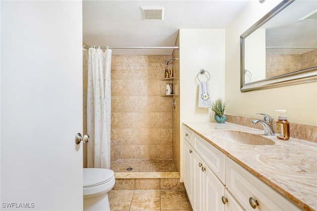6324 Sugar Bush Ln Unit F, Fort Myers, FL 33908 - bathroom featuring vanity, toilet, tiled shower, and tile patterned flooring