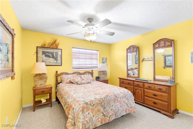 7013 New Post Dr Unit 7, North Fort Myers, FL 33917 - bedroom with light colored carpet, a textured ceiling, ceiling fan, and baseboards