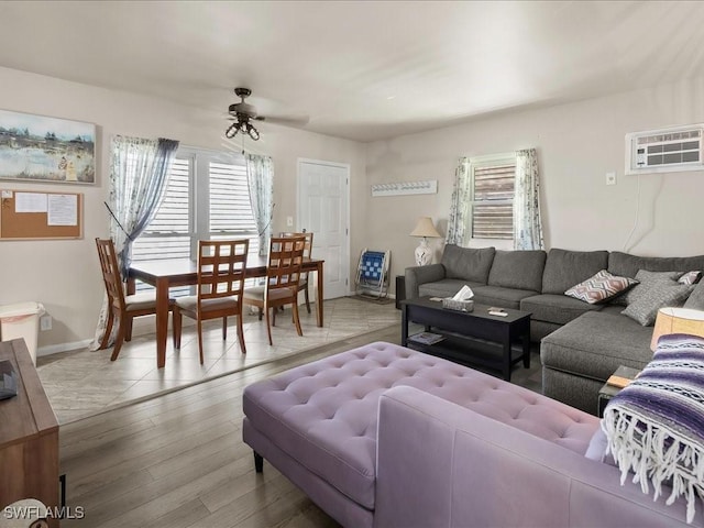 130 N Collier Blvd Unit G6, Marco Island, FL 34145 - living room with a wall mounted air conditioner, healthy amount of natural light, ceiling fan, and wood finished floors