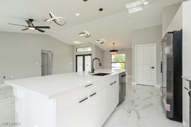 1603 Karen Ave S, Lehigh Acres, FL 33976 - kitchen featuring appliances with stainless steel finishes, a sink, light marble finish floors, pendant lighting, and vaulted ceiling