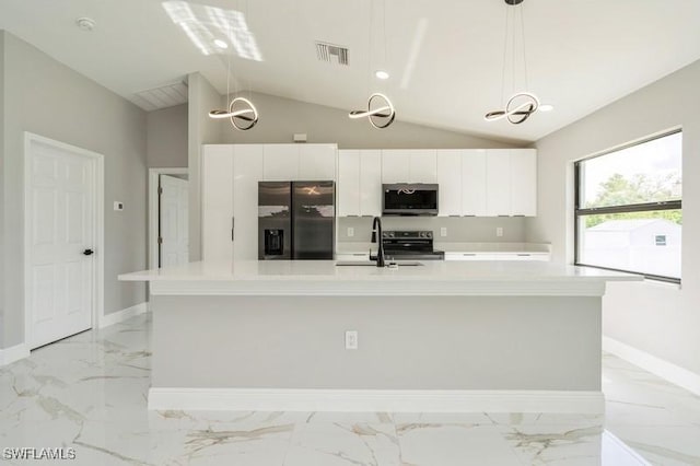 1603 Karen Ave S, Lehigh Acres, FL 33976 - kitchen featuring stainless steel appliances, a sink, light marble finish floors, white cabinetry, and a spacious island