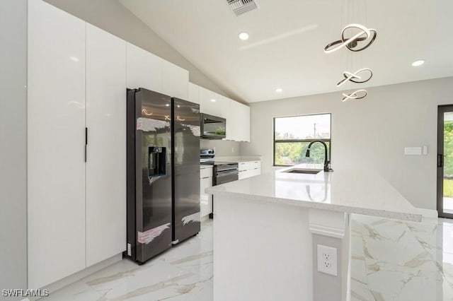 1603 Karen Ave S, Lehigh Acres, FL 33976 - kitchen with appliances with stainless steel finishes, a sink, modern cabinets, light marble finish flooring, and white cabinets