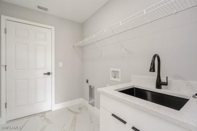 1603 Karen Ave S, Lehigh Acres, FL 33976 - washroom with washer hookup, baseboards, cabinet space, hookup for an electric dryer, and light marble finish floors