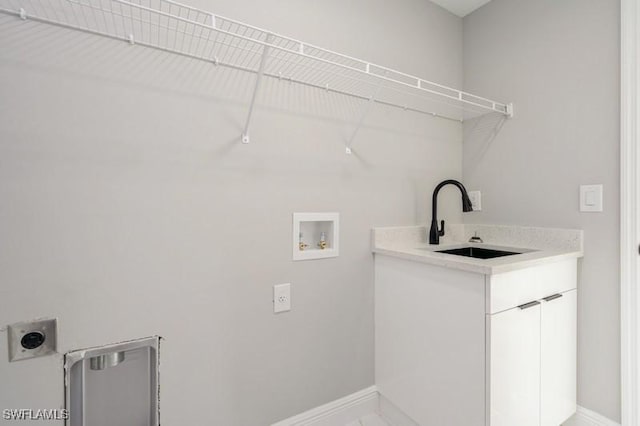 1603 Karen Ave S, Lehigh Acres, FL 33976 - laundry room with electric dryer hookup, baseboards, cabinet space, and hookup for a washing machine