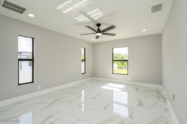 1603 Karen Ave S, Lehigh Acres, FL 33976 - spare room with light marble finish flooring, baseboards, recessed lighting, and a ceiling fan