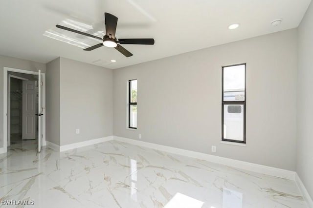 1603 Karen Ave S, Lehigh Acres, FL 33976 - empty room featuring light marble finish floors, baseboards, recessed lighting, a ceiling fan, and a smoke detector