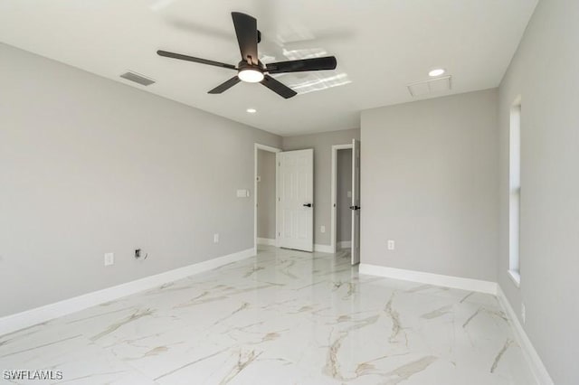 1603 Karen Ave S, Lehigh Acres, FL 33976 - unfurnished bedroom with baseboards, recessed lighting, light marble finish flooring, and ceiling fan