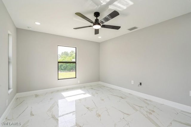 1603 Karen Ave S, Lehigh Acres, FL 33976 - spare room featuring light marble finish flooring, recessed lighting, baseboards, and a ceiling fan