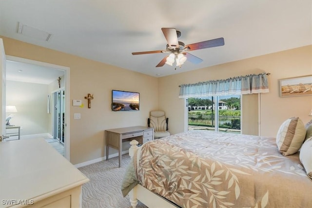 5805 Declaration Ct, Ave Maria, FL 34142 - bedroom with light colored carpet, baseboards, a ceiling fan, and a water view