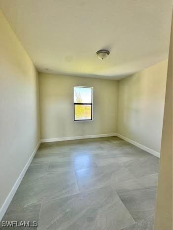 3007 53rd St W, Lehigh Acres, FL 33971 - unfurnished room with baseboards