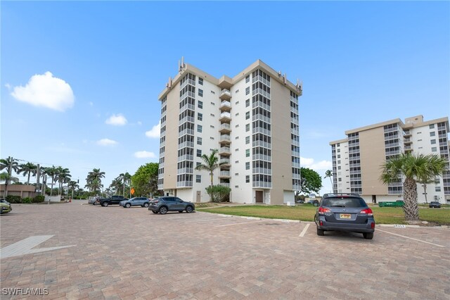5500 Bonita Beach Rd Unit 502, Bonita Springs, FL 34134 - view of apartment building / complex with uncovered parking