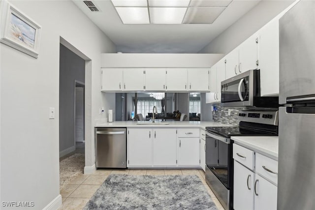 3410 Frosty Way Unit 4802, Naples, FL 34112 - kitchen with appliances with stainless steel finishes, a sink, light countertops, and white cabinets