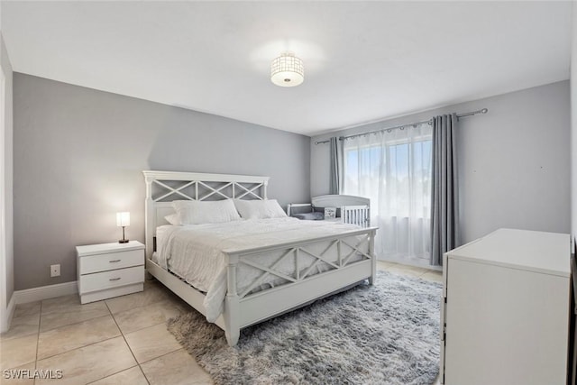 3410 Frosty Way Unit 4802, Naples, FL 34112 - bedroom featuring light tile patterned floors and baseboards